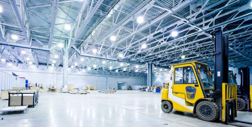 a yellow vehicle in a warehouse