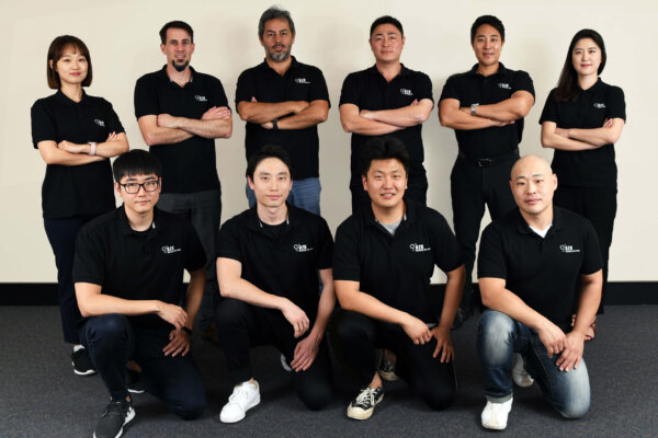 a group of ozk team posing for a photo