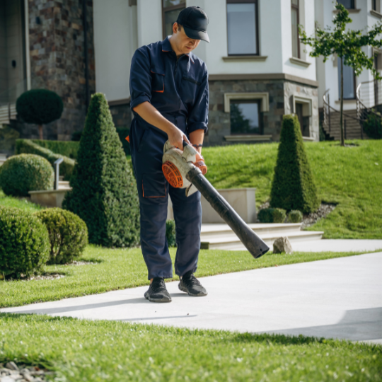 Using,Leaf,Blower.,Professional,Gardener,Is,On,The,Lawn.